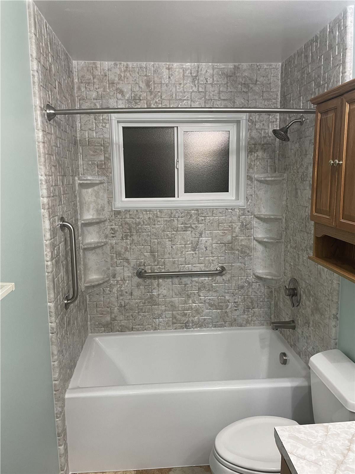 After - clean white tile walk-in shower